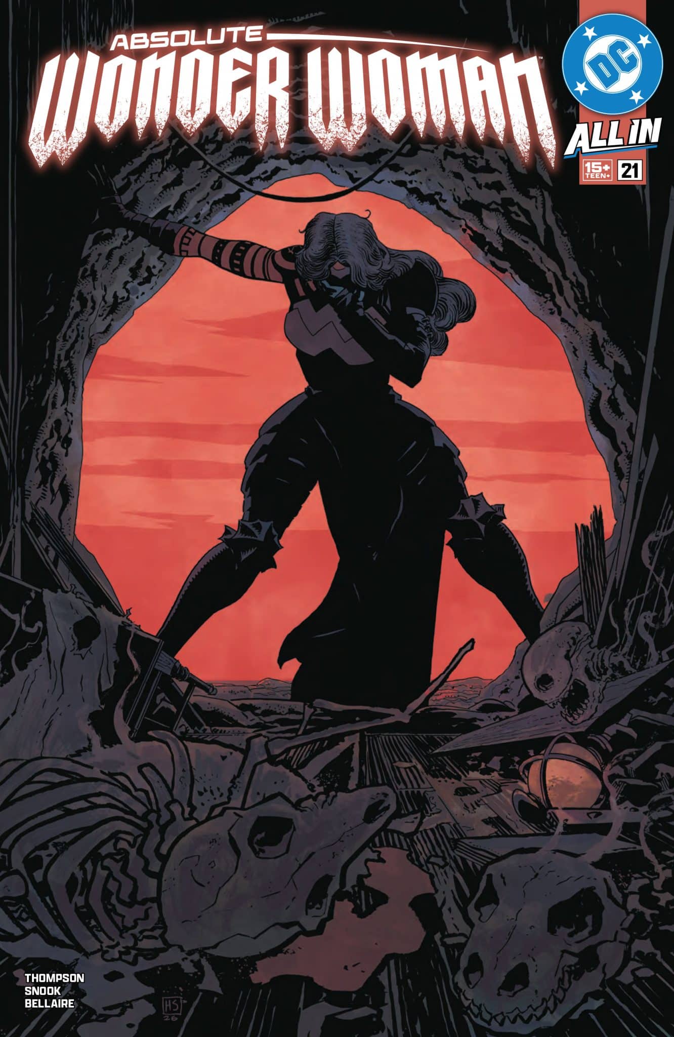 Cover of Absolute Wonder Woman comic issue 21, featuring a silhouette of Wonder Woman in a dramatic pose amidst a dark, rocky landscape with skulls and debris.