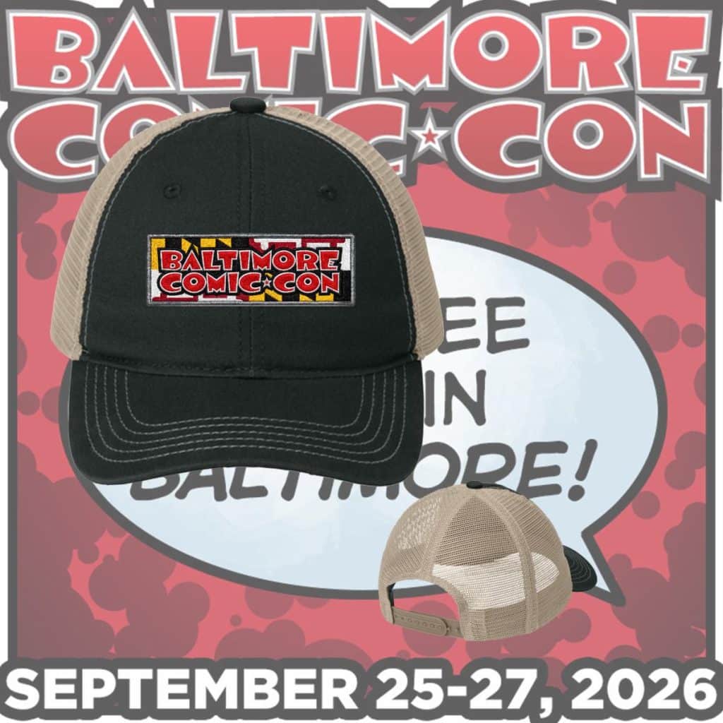 A black and beige cap featuring the logo of Baltimore Comic-Con against a colorful background, announcing the event dates of September 25-27, 2026.