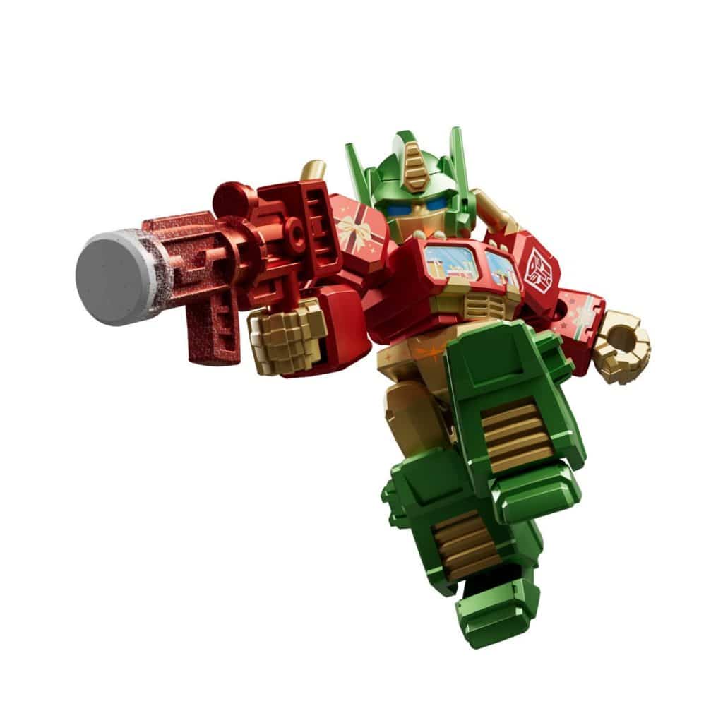 A colorful action figure of a robot in a dynamic pose, brandishing a large gun. The robot features red and green armor with blue eyes and a unique design.