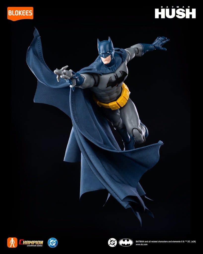 A detailed action figure of Batman from the Hush series, posed dynamically with a flowing cape and iconic costume elements, displayed against a dark background.