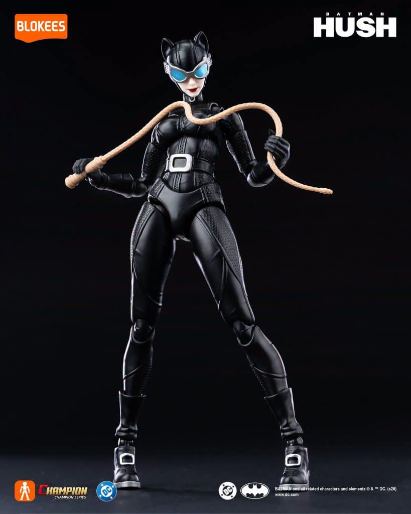 Action figure of Catwoman from Batman Hush, posed confidently with a whip, wearing a black catsuit and sunglasses, against a black background.