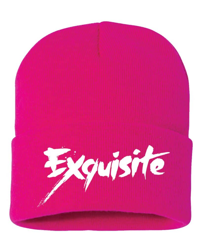 A bright pink beanie hat with the word 'Exquisite' printed in bold white lettering.
