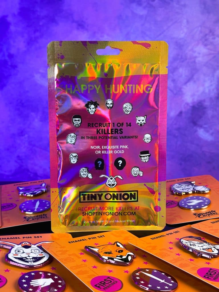 A colorful packaging for Tiny Onion's enamel pin set, featuring the text 'HAPPY HUNTING' and promoting 'RECRUIT 1 OF 14 KILLERS' with illustrations of various characters on the front.