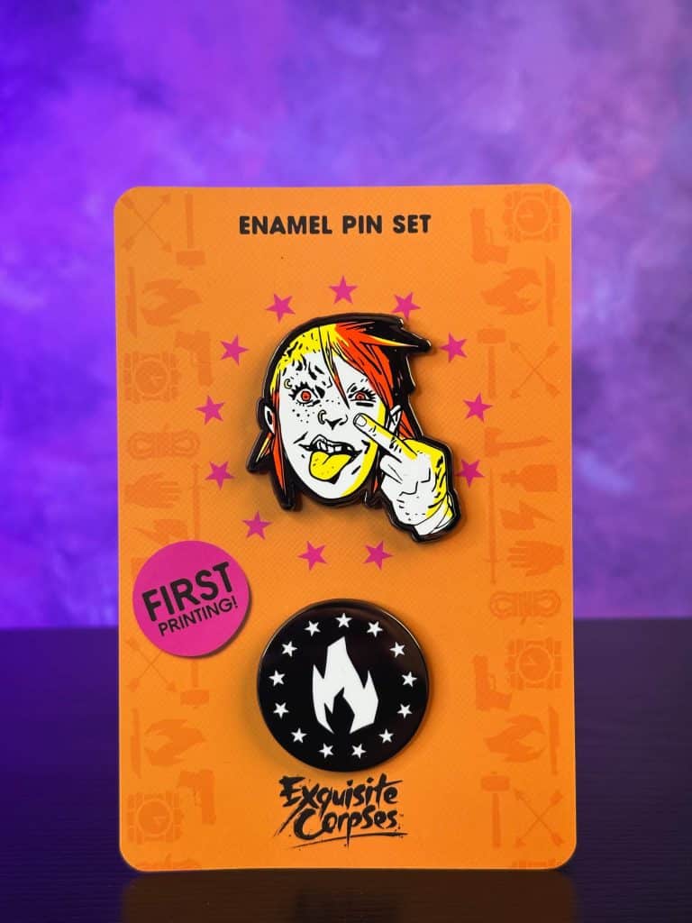 Enamel pin set featuring a colorful cartoon face sticking out its tongue, set against an orange background with stars and a logo for 'Exquisite Corpses.'