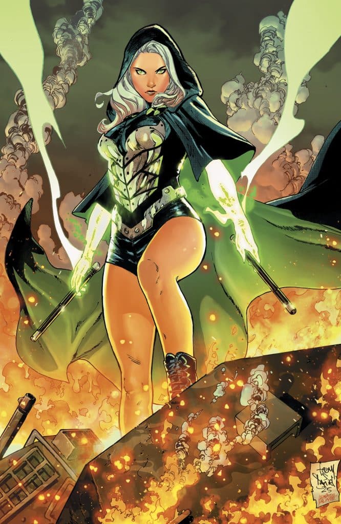 A powerful female character in a dark hooded cloak stands confidently amidst flames and smoke, holding weapons in her hands.
