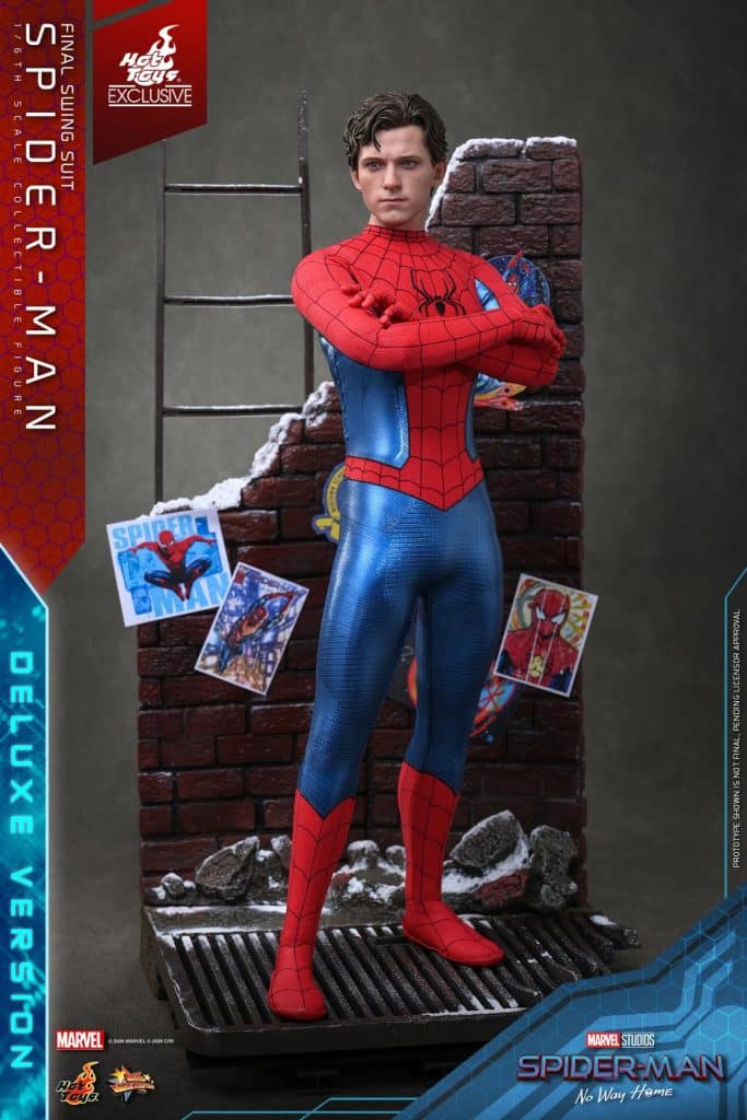 A collectible figure of Spider-Man in his final swing suit, standing confidently with crossed arms, set against a brick wall background adorned with Spider-Man comic illustrations.
