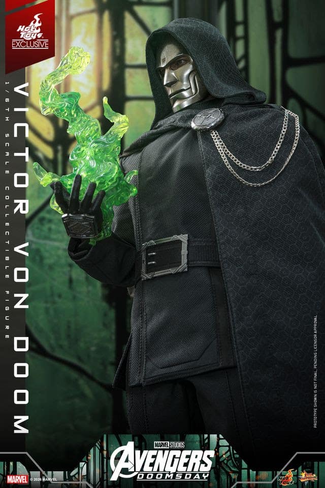 A collectible figure of Victor Von Doom, dressed in a black cloak with a hood, holding a glowing green object in his right hand, set against a dark background with a stylized design.