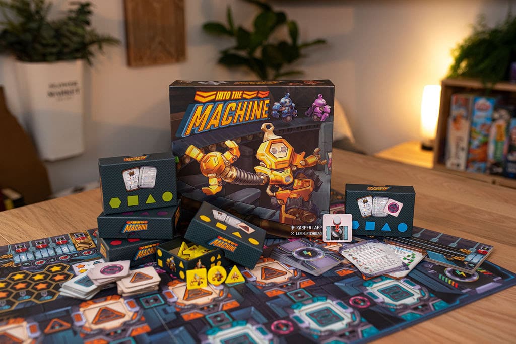 A tabletop game called 'Into the Machine' featuring a colorful box and various game components including cards and tokens laid out on a wooden surface.