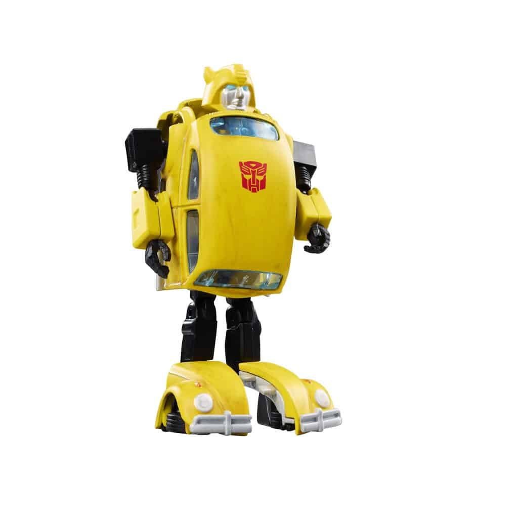 A yellow robot figure resembling a car, featuring a logo on its chest, standing upright with a playful expression.