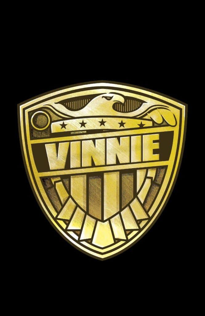 A gold emblem featuring the name 'VINNIE' in bold letters, surrounded by decorative elements including an eagle and stars.