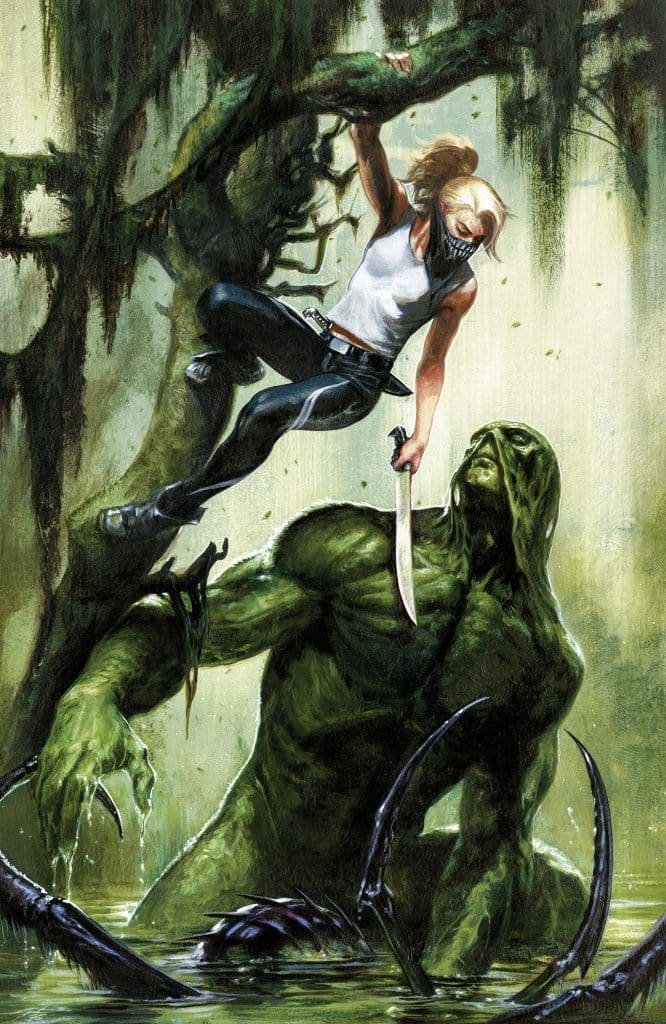A woman with a knife stands on a branch above a large, creature covered in green moss in a swampy setting. The woman is poised in an action stance, while the creature looks up at her, surrounded by dark water and eerie vegetation.