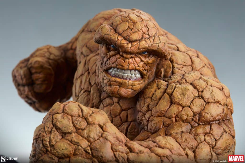 A detailed close-up of a collectible figure depicting a muscular character with a rocky texture, showcasing a fierce expression and clenched fist.