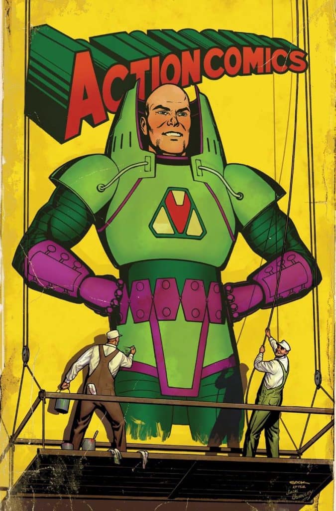 Illustration of a giant superhero figure in a green and pink suit, featured on a bright yellow background with the text 'ACTION COMICS' above. Two men in work clothes are painting and adjusting the figure on a stage.