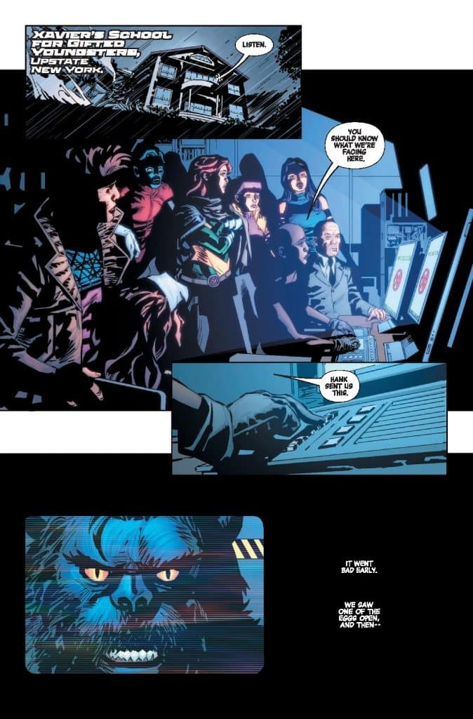 Comic panel depicting characters at Xavier's School for Gifted Youngsters. A group of superheroes is gathered around a computer, discussing a serious situation, with a close-up of a blue, beastly character's face on the screen.
