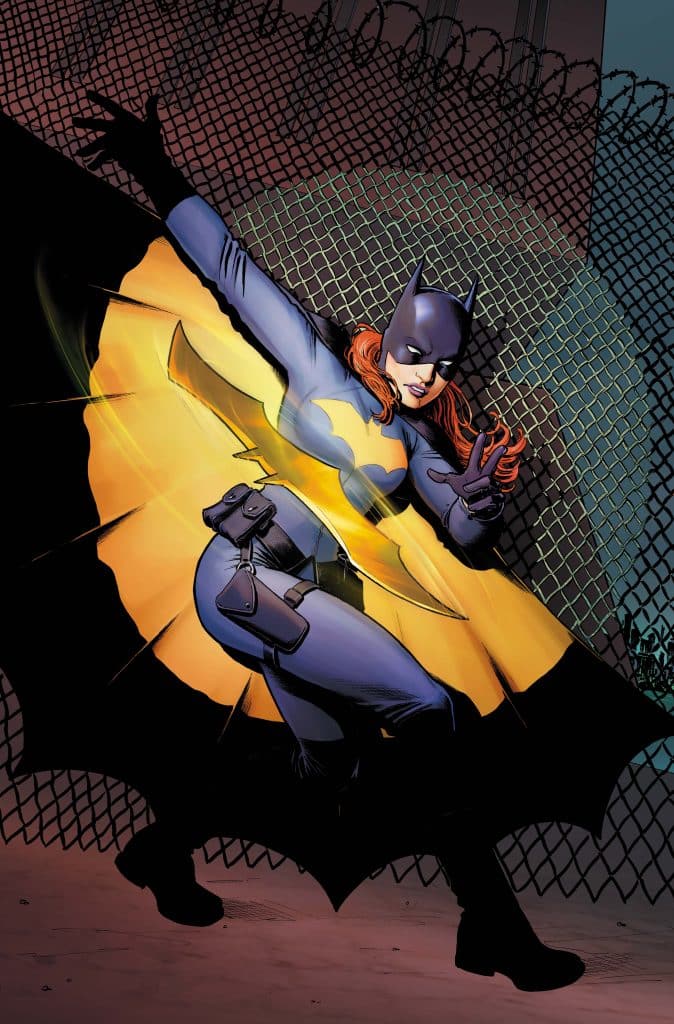A female superhero in a blue and yellow costume strikes a dynamic pose against a backdrop of a chain-link fence, embodying confidence and strength.