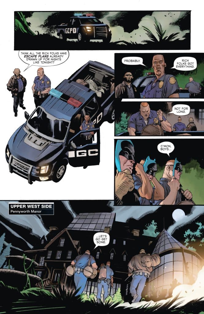 A group of armed individuals and police officers converse outside a police vehicle in a dark, wooded area, with a lavish mansion in the background under a moonlit sky.