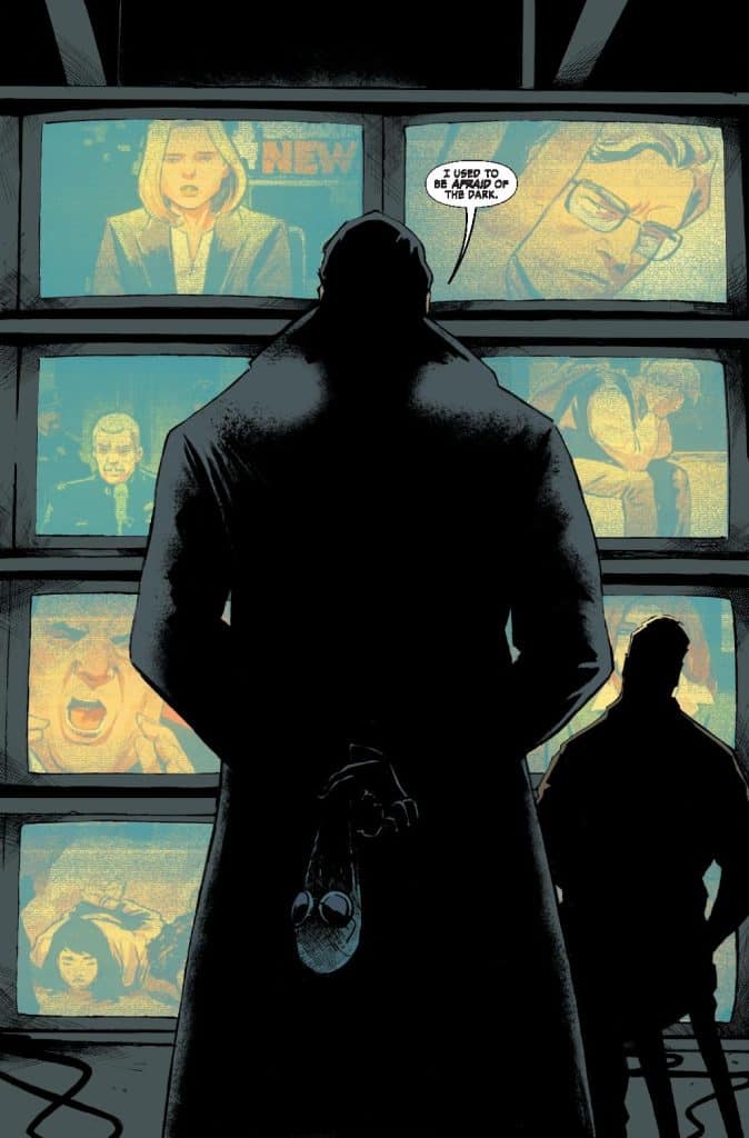 A shadowy figure stands with their back to the viewer, holding a small object, in front of multiple vintage television screens displaying various news images. The text bubble above the figure reads, 'I used to be afraid of the dark.'