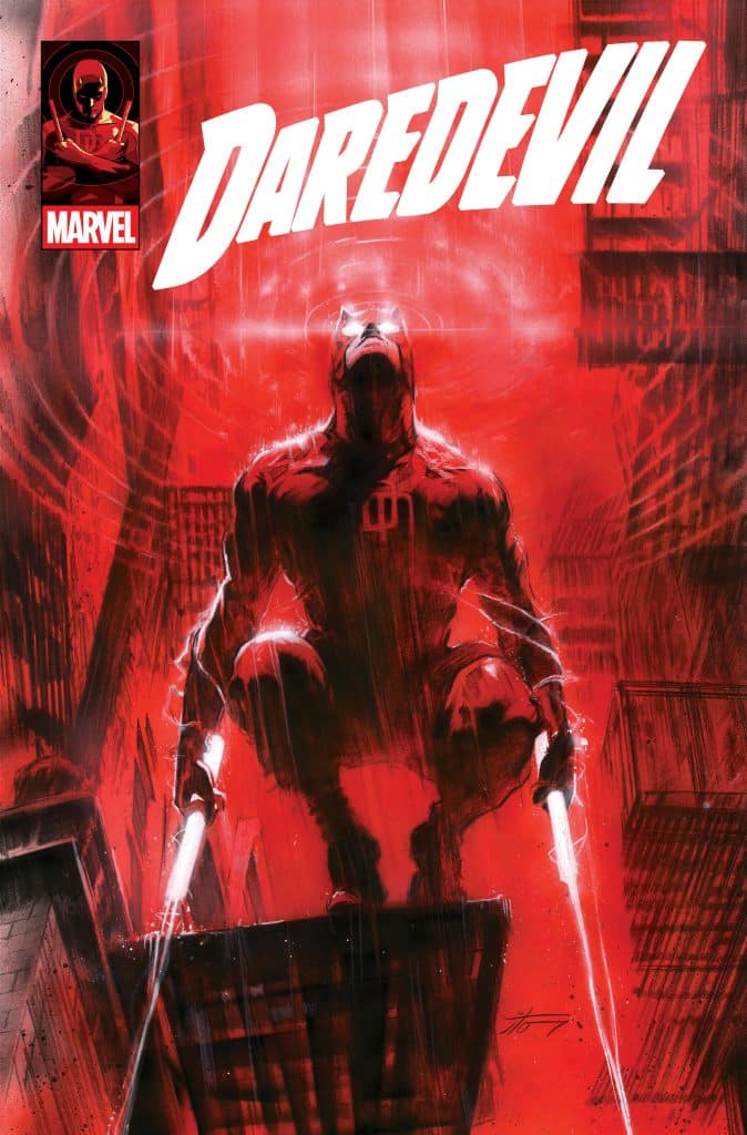 Comic book cover featuring Daredevil, a superhero in a dark red suit, poised on a rooftop with his signature billy clubs, surrounded by a red urban backdrop.
