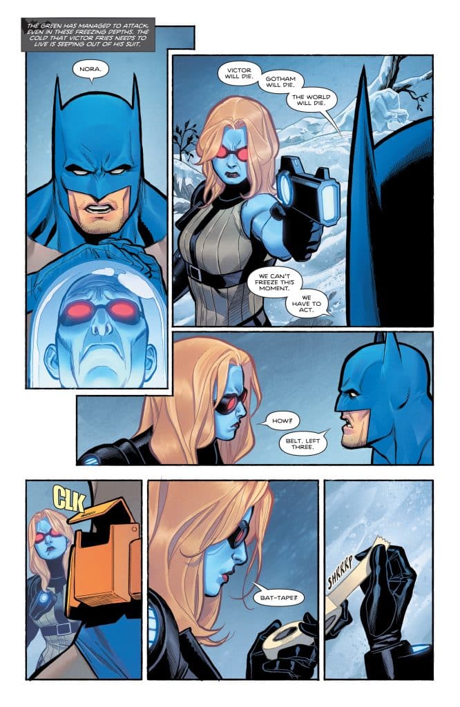 A comic panel featuring Batman and a blue-skinned female character with long hair, holding a futuristic device. Batman shows a serious expression, while the female character looks determined. The background depicts a snowy landscape.