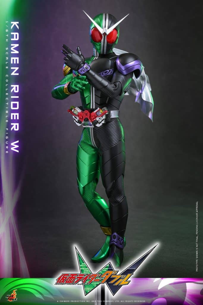A detailed collectible figure of Kamen Rider W, featuring a green and black suit with red eyes and a silver helmet. The figure is posed in a dynamic stance, showcasing its unique design and accessories.