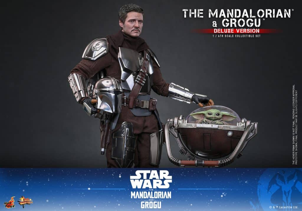 A detailed figure of The Mandalorian character in armor, holding a floating cradle with Grogu inside, set against a dark background.