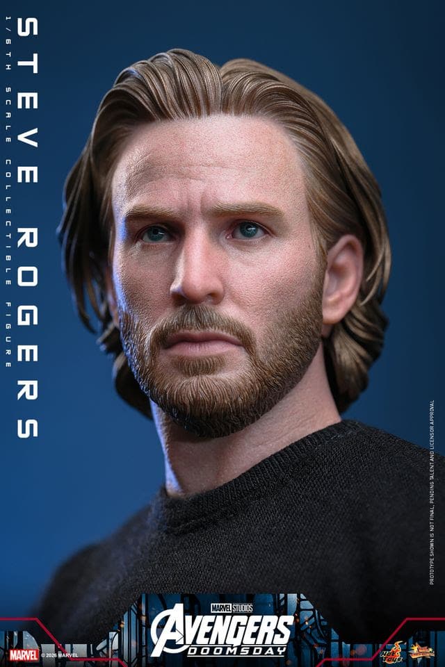 A detailed, lifelike collectible figure of Steve Rogers, featuring realistic facial features, hair, and a soft sweater. The background is a solid blue, emphasizing the figure.