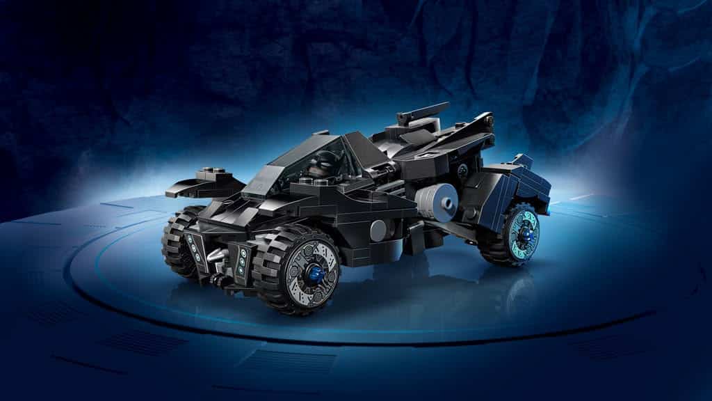 A detailed image of a black LEGO Batmobile model displayed on a circular stand against a blue abstract background.