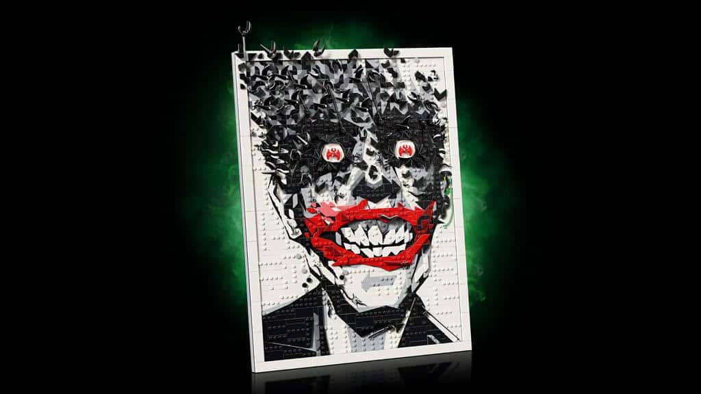 A stylized, fragmented artwork of a character's face with a twisted smile and dark hair, featuring a vibrant red mouth and striking white teeth, set against a black background with a green mist effect.