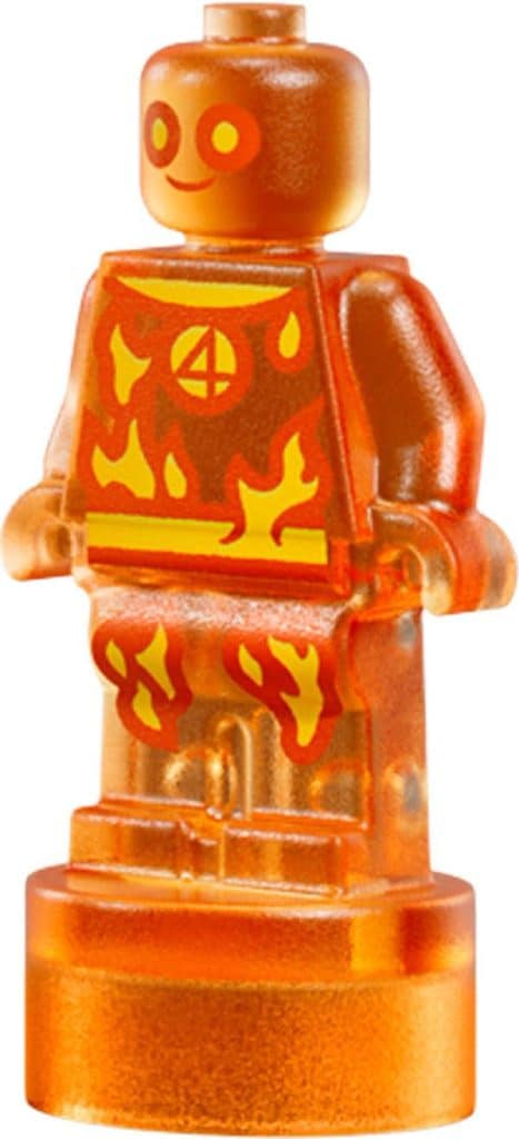 A transparent orange LEGO minifigure with a smiling face, featuring a flame design on its torso and legs.