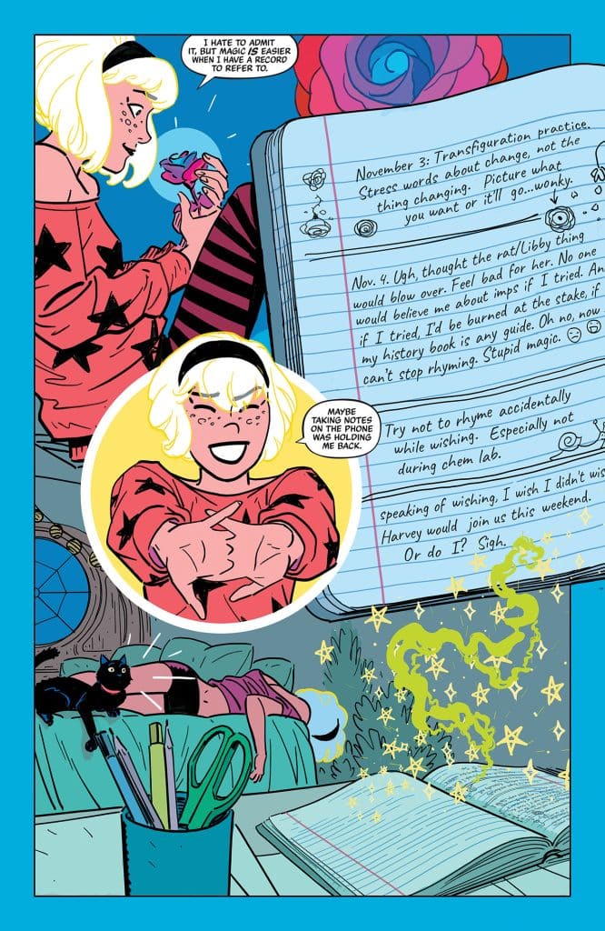 A character with blonde hair in a playful outfit holds a mystical object while sitting at a desk cluttered with stationery. A cat lounges on the desk, and magical sparkles are depicted around the character.