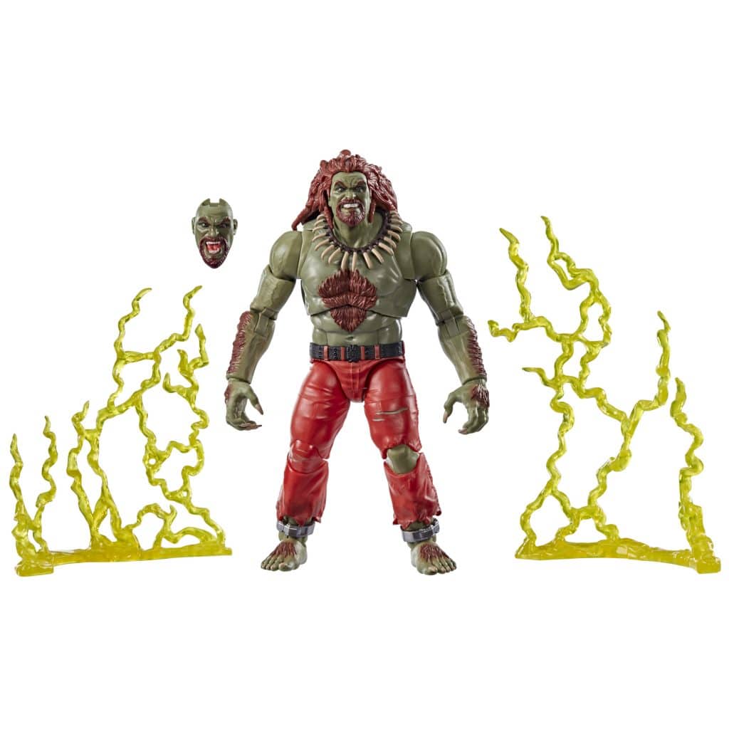 Action figure of a muscular character with green skin and red pants, accompanied by an alternate head and yellow energy effects.