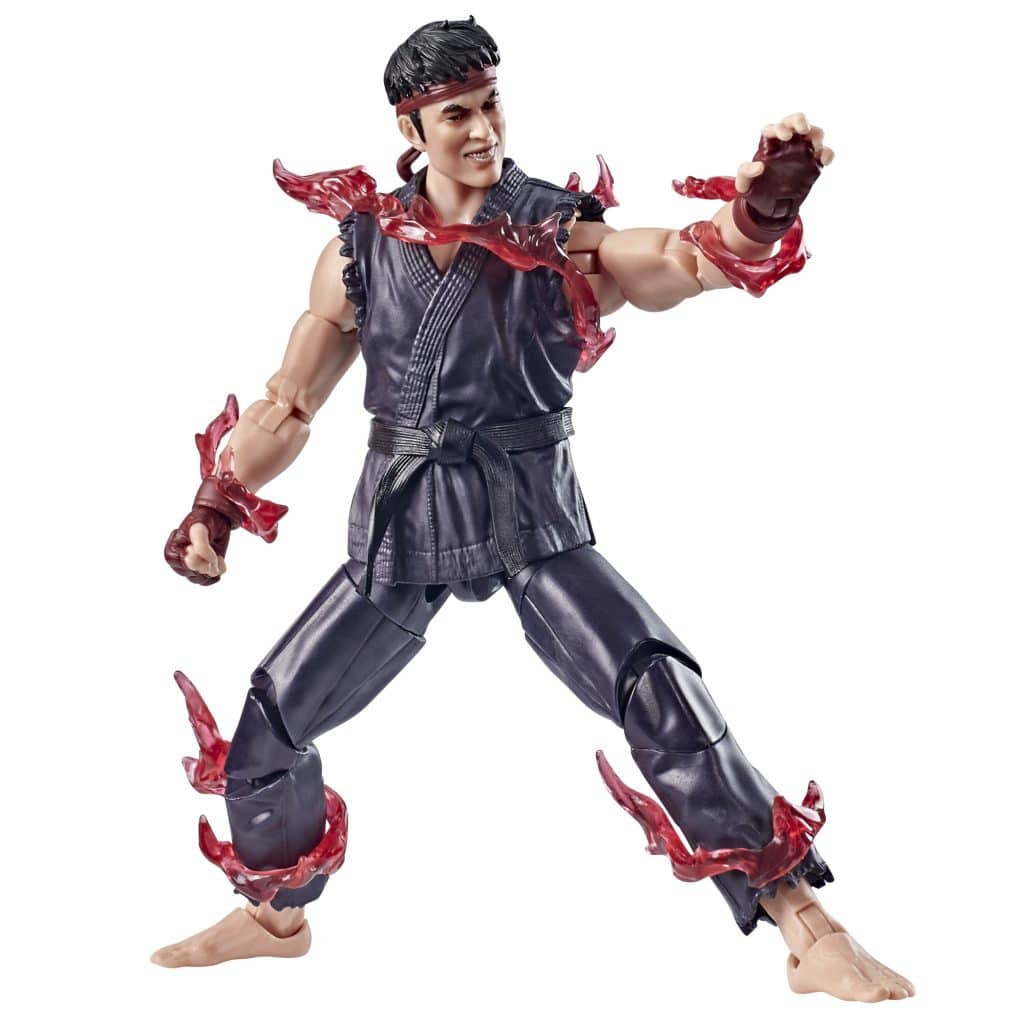Action figure of a martial artist character in a black outfit with red energy effects around his arms and legs, posed in a fighting stance.