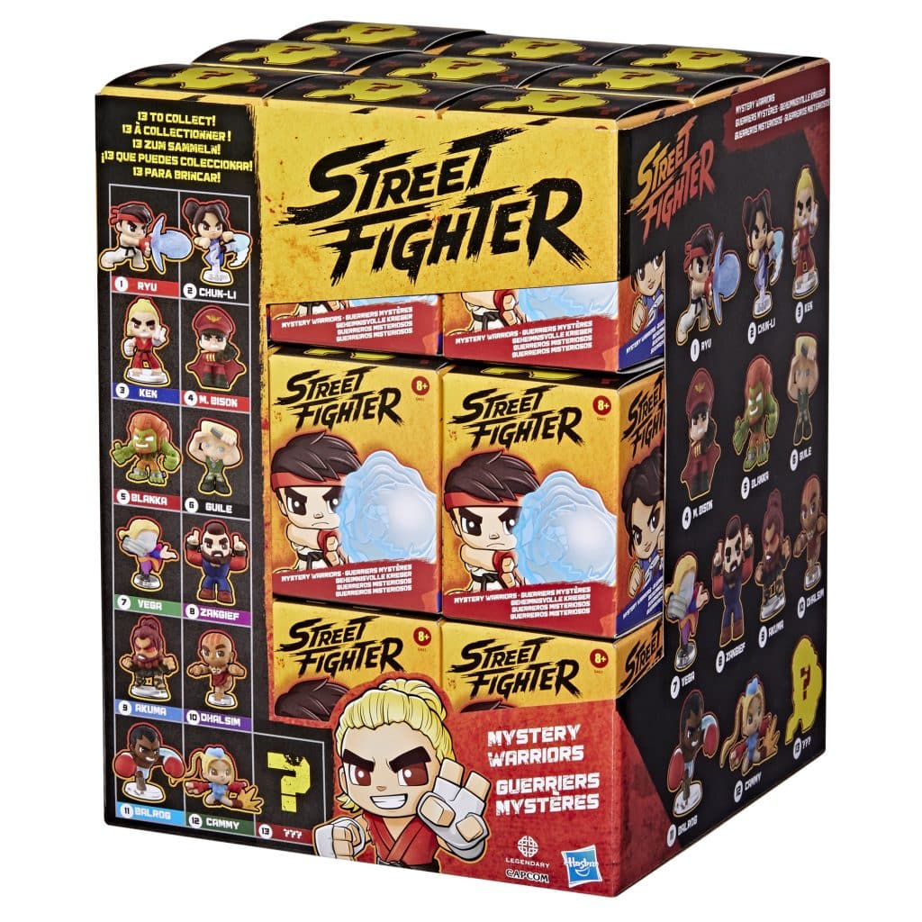 Display box of Street Fighter collectible figures featuring various characters like Ryu, Chun-Li, and Ken, with a mysterious warrior section.