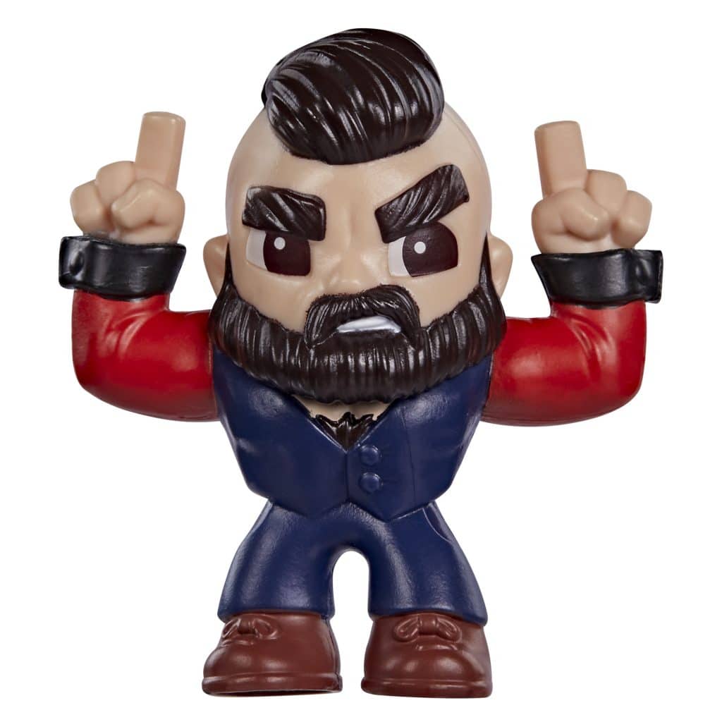 A small figurine of a muscular character with a beard, wearing a blue suit and red sleeves, making a gesture with both hands.