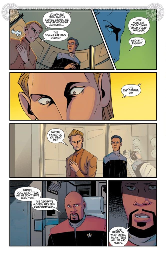 A comic book panel featuring two characters in Starfleet uniforms, engaging in a serious conversation. One character, with a concerned expression, is discussing an incoming message, while the other character appears anxious. The background includes a futuristic setting with starship elements. Dialogue includes references to a compromised mission.