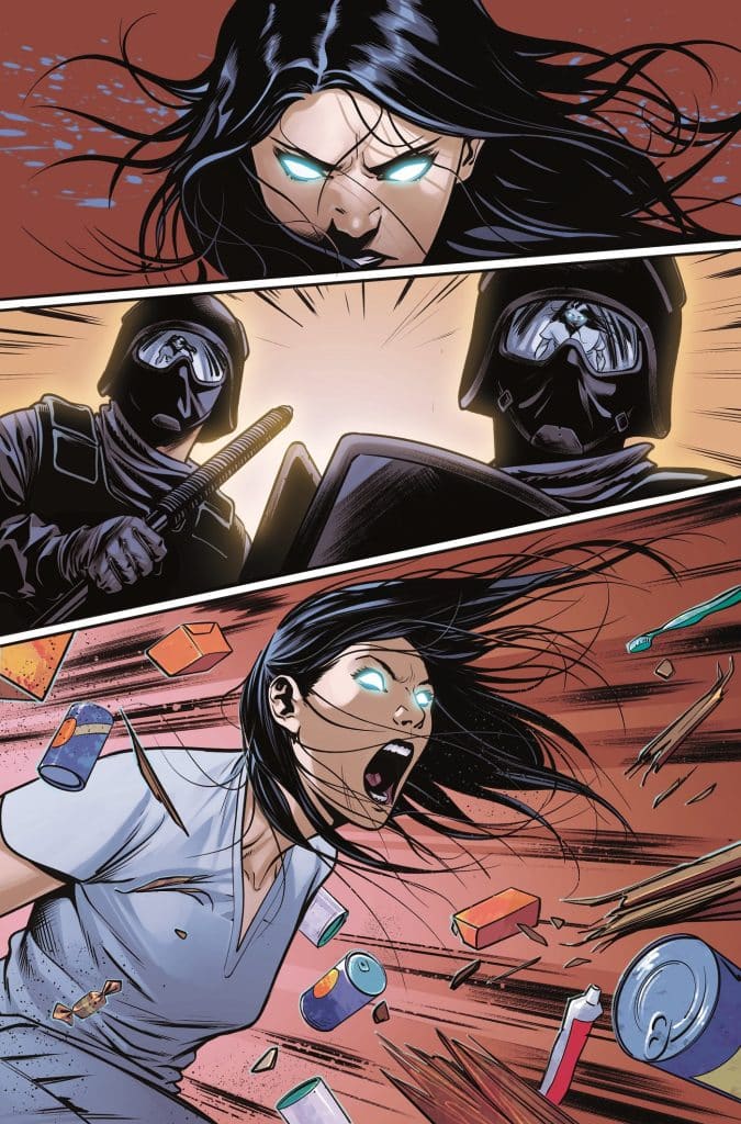 A fierce woman with glowing eyes and wind-blown hair is screaming in anger, surrounded by flying objects including cans and other debris, while two masked figures stand menacingly in the background.