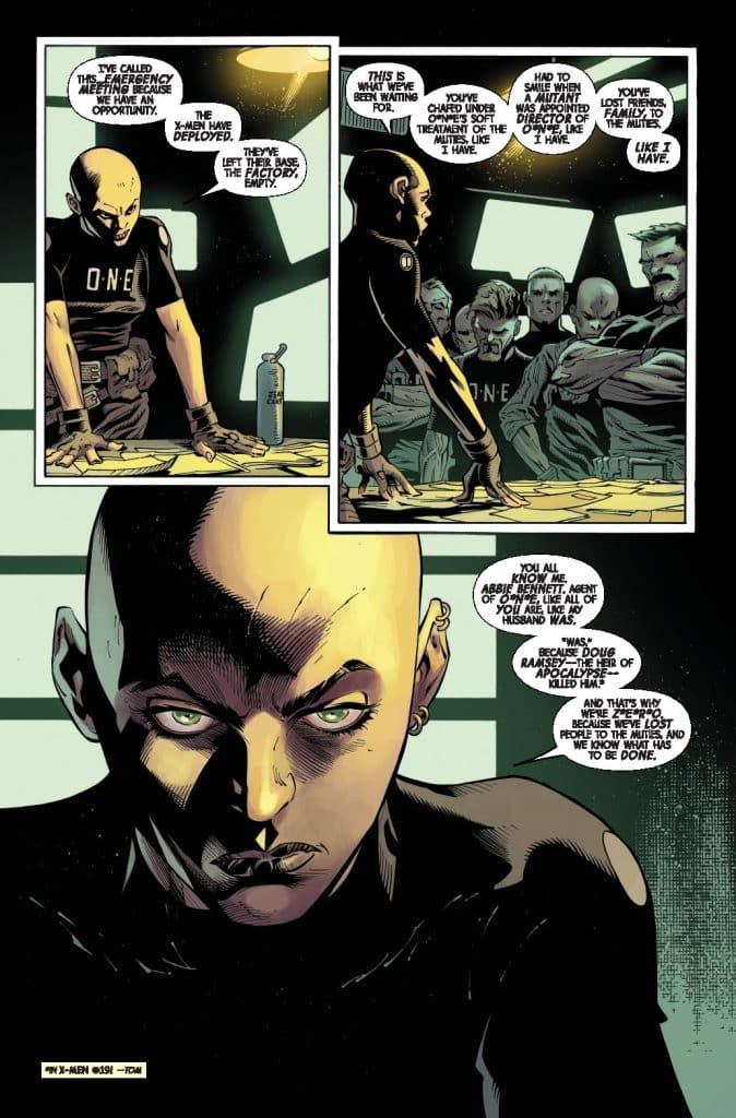 A comic book panel featuring a bald character in a black uniform addressing a group of people. The character has intense green eyes and is speaking about past events and loss, while the others listen attentively.